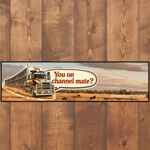 Truck bumper sticker with a humorous message on a wooden background