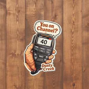 Sticker of a handheld radio with 'You on Channel?' text on a wooden background, featuring the brand 'Dusty Creek'.